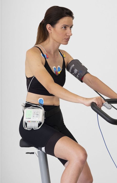 Woman on bike doing the ECG test